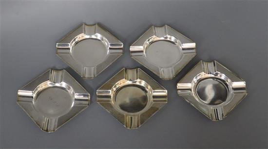 Five George V silver engine turned ashtrays, Sheffield 1946 & 56, by Mappin & Webb, 8cm.